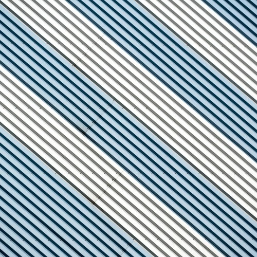 Abstract diagonal stripes in metallic tones create a dynamic modern design.